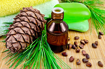 Image showing Oil cedar with pine cones and soap