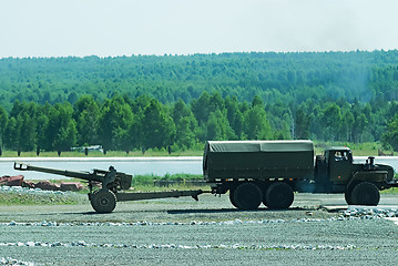 Image showing army truck transports a gun