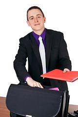 Image showing Businessman presenting folder