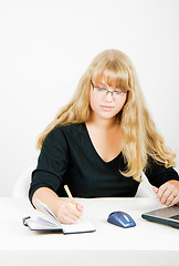 Image showing blonde girl with glasses writes