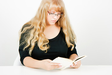 Image showing blonde girl with glasses reading