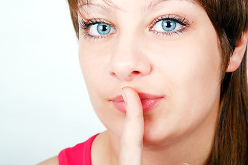 Image showing girl with a finger to his lips