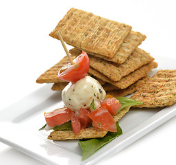 Image showing Crackers With Mozzarella And Tomatoes