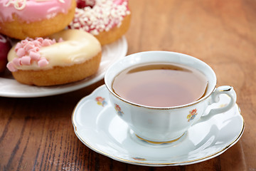Image showing tea cup and doughnuts