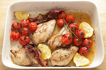 Image showing Cooking grilled chicken and tomatoes