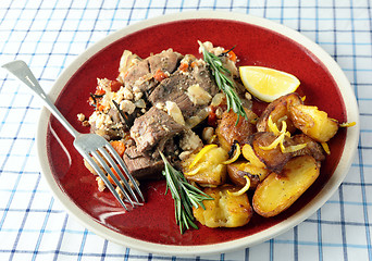 Image showing Kleftiko and lemon roast potatoes