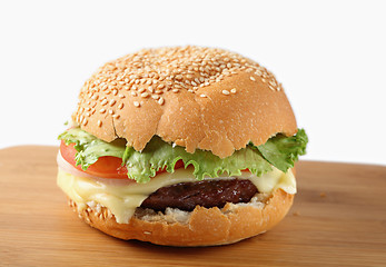 Image showing Cheeseburger on a board