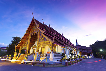 Image showing Wat Phra Singh temple at sunset in Chiang Mai, Thailand.