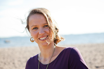 Image showing Happy smiling woman at beach.