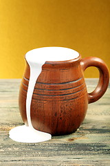 Image showing Ceramic mug with cream.