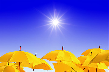 Image showing yellow umbrellas on celestial background