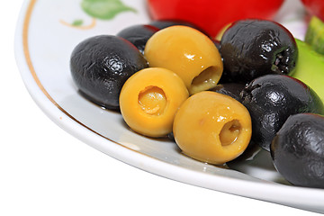 Image showing olives in a blue plate on a white background
