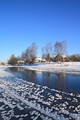 Image showing winter village on coast river 