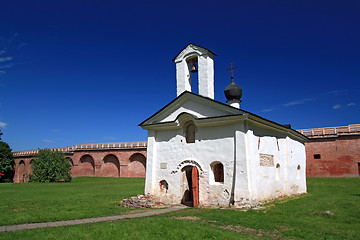 Image showing aging blanching church amongst green herb