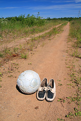 Image showing shabby shoe on rural road