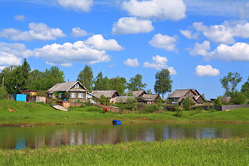 Image showing aging village on river coast