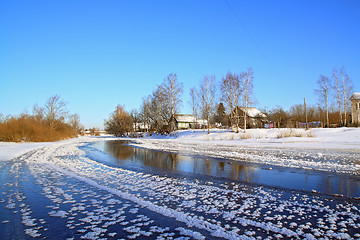 Image showing winter village on coast river 