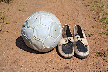 Image showing shabby shoe on rural road