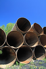 Image showing old gas pipes amongst herbs