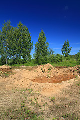 Image showing old sandy quarry in green wood