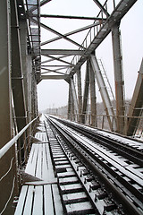 Image showing railway bridge through freeze river 