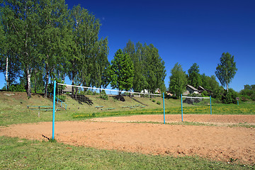 Image showing volleyball net amongst summer tree