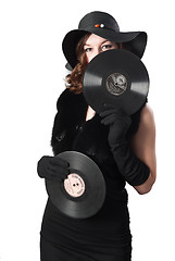 Image showing Pretty girl holding vinyl disc