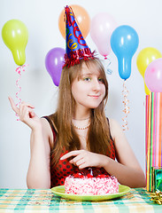 Image showing Happy birthday. Attractive young girl with cake
