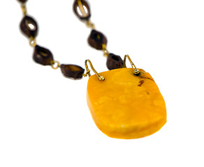 Image showing Big amber stone necklace isolated on white 