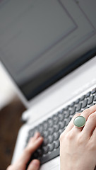 Image showing Young woman working on laptop