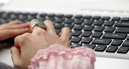 Image showing Young woman working on laptop