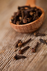 Image showing cloves in wooden spoon 