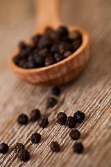 Image showing black pepper in wooden 