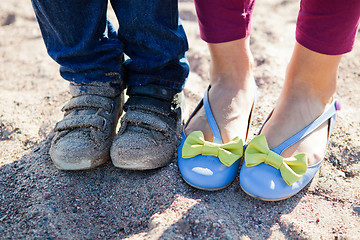 Image showing Close-up of feet on beach.