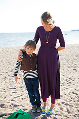 Image showing Mother and son at beach.