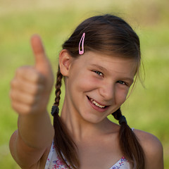 Image showing Young girl showing thumbs up