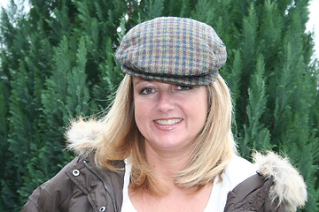 Image showing Smiling girl in tuff cap