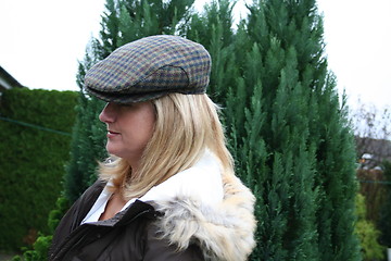 Image showing Blonde with cap in profile