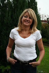 Image showing Lovely girl standing in the garden