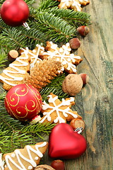 Image showing Christmas toys, cookies and spruce branches.