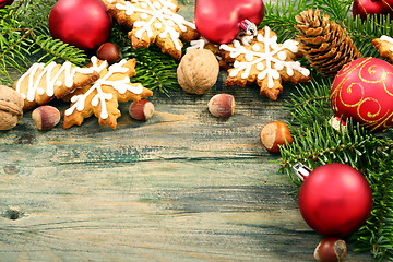 Image showing Gingerbread cookies with fir cones and Christmas toys.