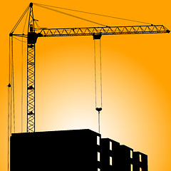 Image showing Silhouette of crane on a sunset on a building