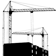Image showing Silhouette of two cranes working on the building