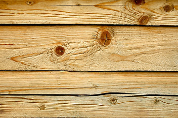 Image showing Parallel wooden cracked logs close up