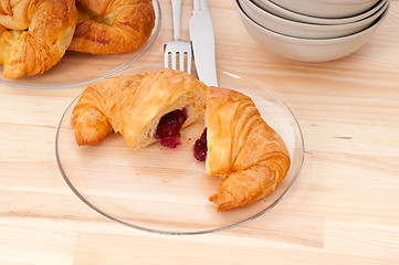 Image showing croissant French brioche filled with berries jam