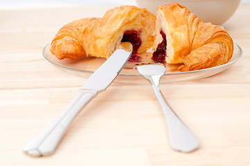 Image showing croissant French brioche filled with berries jam