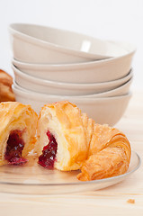 Image showing croissant French brioche filled with berries jam