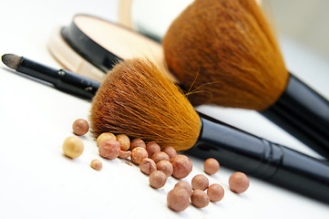 Image showing Makeup foundation, powder, bronzer and brushes