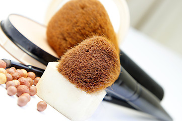 Image showing Makeup foundation, powder, bronzer and brushes