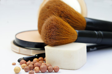 Image showing Makeup foundation, powder, bronzer and brushes